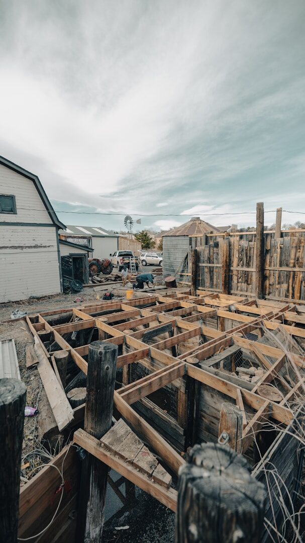 Wooden structure under construction on a farm