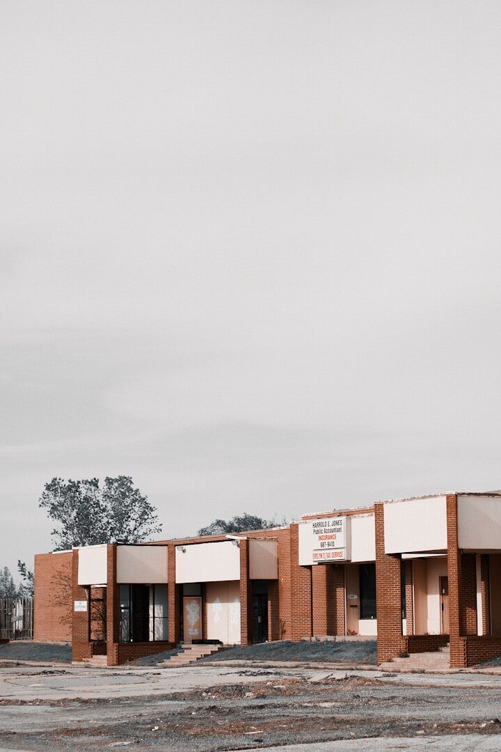 brown concrete building under white sky during daytime
