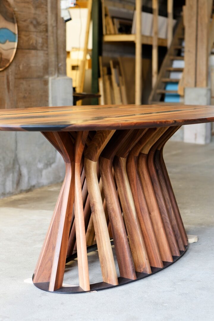 A table made out of wooden sticks and a clock